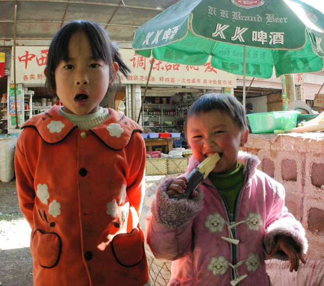 China_Feb_04_28.jpg - Sugar Cane, Lijiang, China These market kids demanded that I take their picture.  14x18 framed