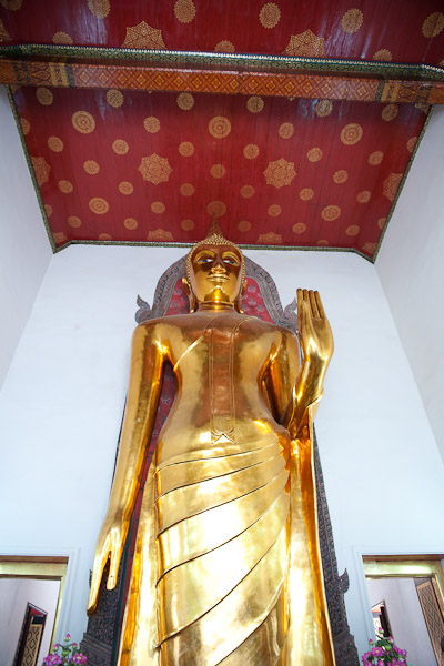 Thailand_Bangkok_OctNovDec_2010_2765.jpg - Standing Buddha.  About twenty feet tall.  The extended hand is the giving or receiving gesture.  There are 28 standard Buddha positions.